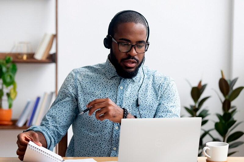 Young Man Working from Home on a Conference Call