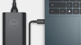 Picture of a Dell Inspiron 14 7420 Laptop with a charger connected to it. 