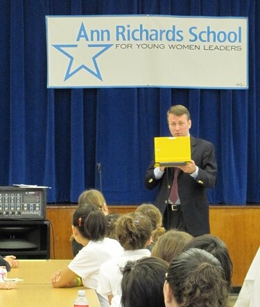 Paul Bell, Dell Inc., with a Yellow Latitude 2100 Netbook