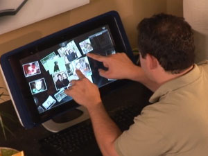 Click for video of person using all-in-one and its touch capabilities
