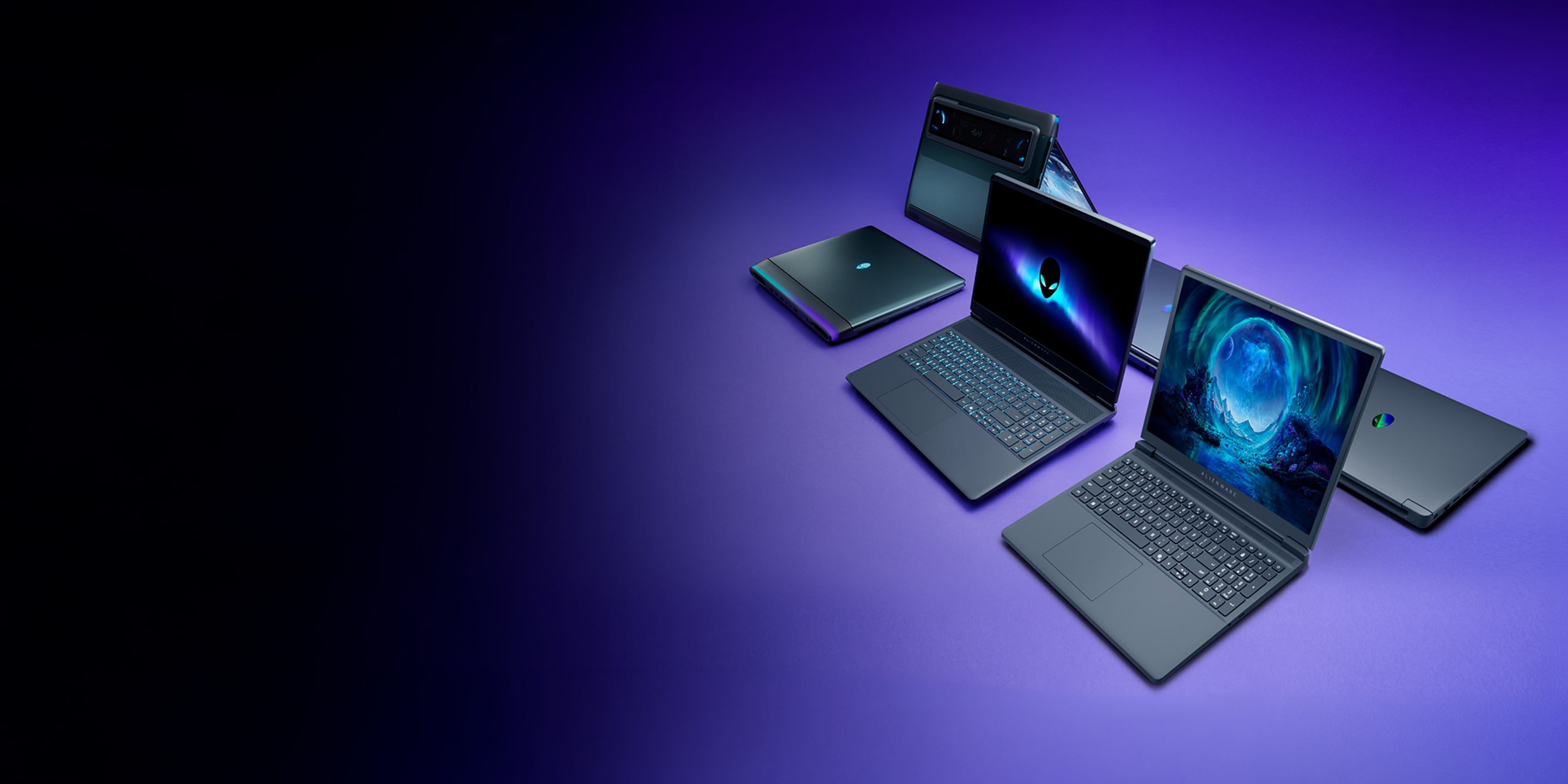 The Alienware 15, 16X Aurora, and 16 Area 51 are placed on a in a physical purple space.