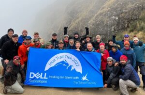 Image of several Dell Employees behind a banner while hiking the Inca Trail in 2022