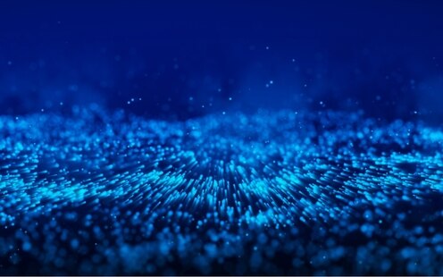 3D generated image of dynamic energy, in multiple shades of blue. Representative of 3D data visual workload generated by data center computing power.