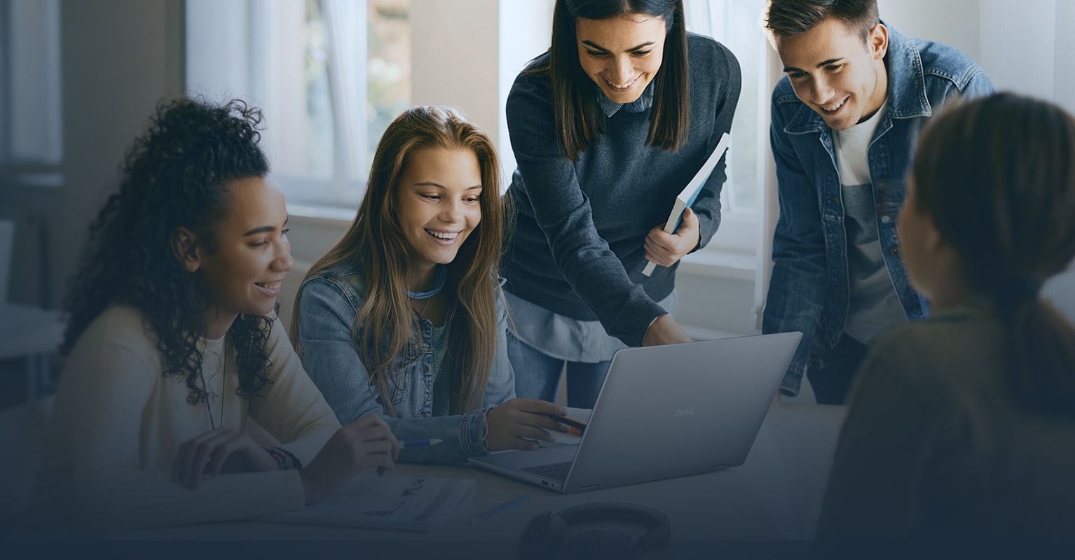 Group of people looking at computer and smiling