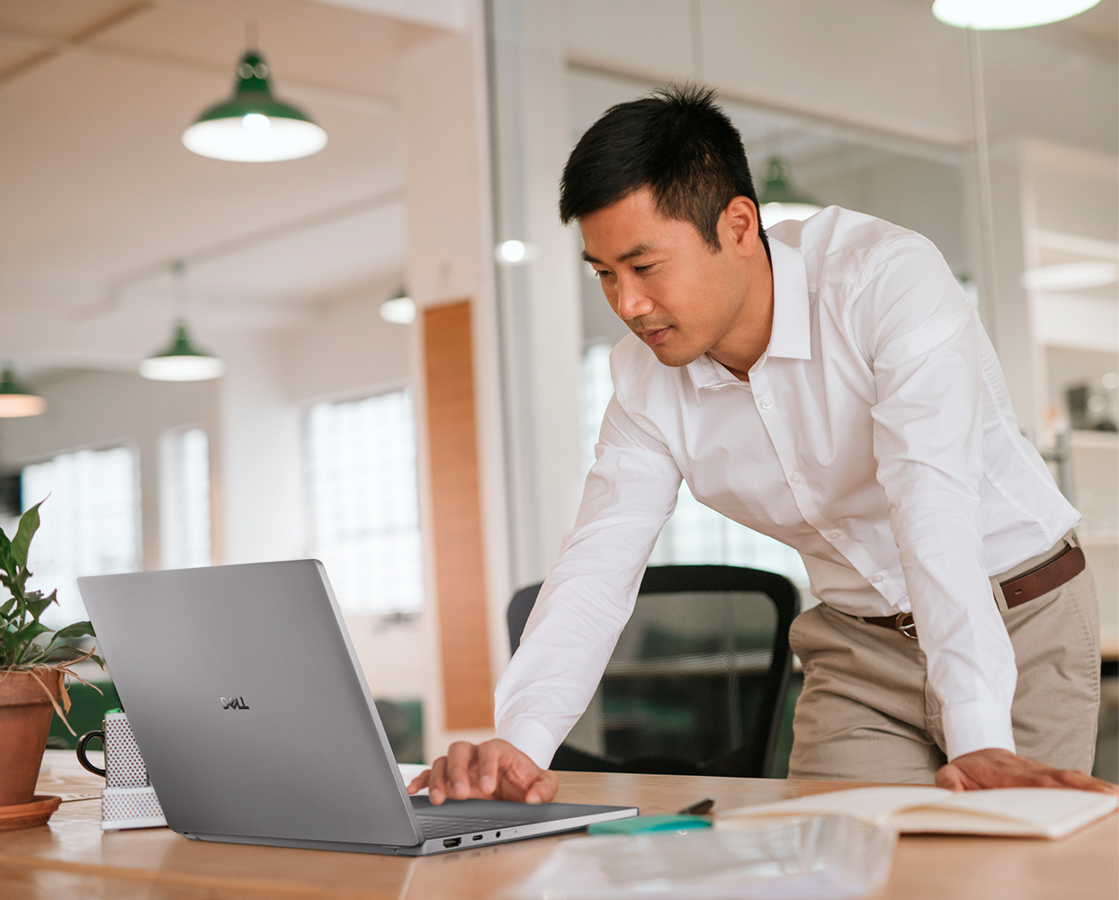 Focused businessman working on his laptop in a modern office
