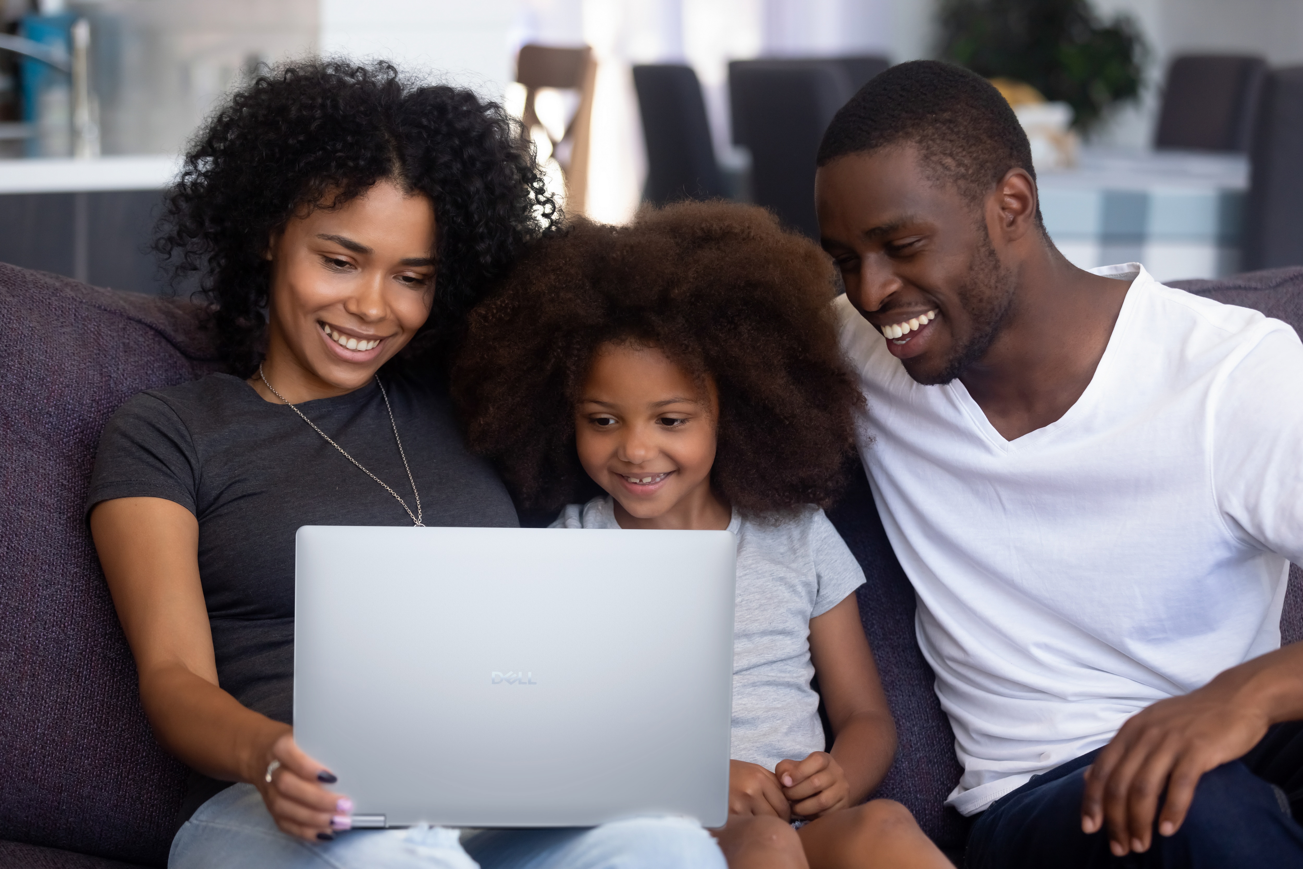 Happy Family Using Laptop Together