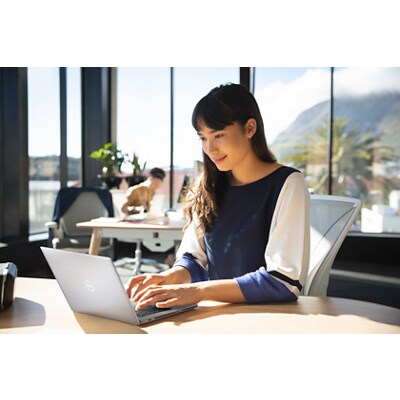 Businesswoman in Office With Mountain View