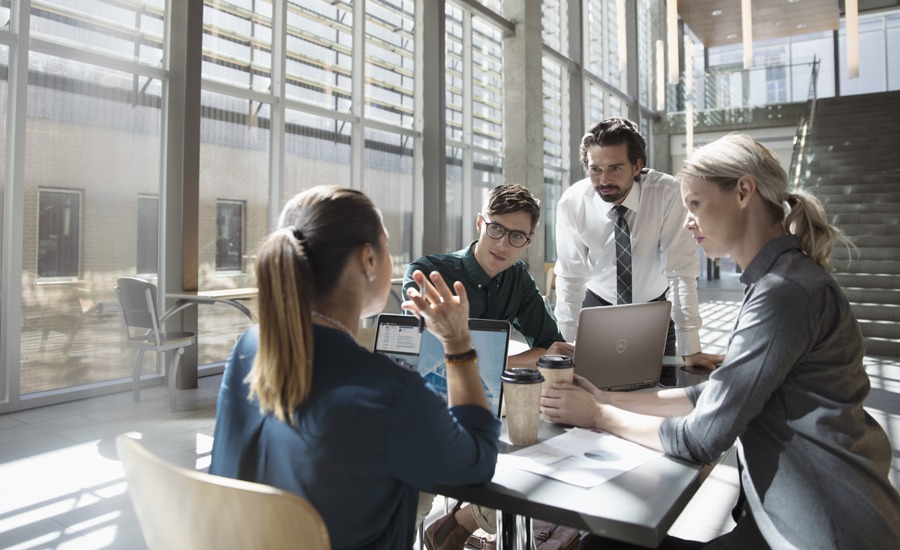 Colleagues discussing at office space