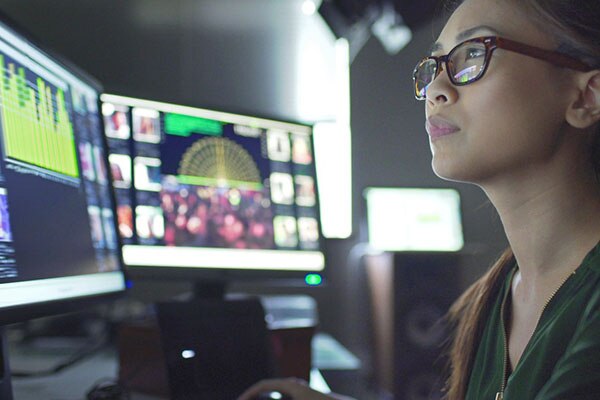 Female Computer Engineer Works on a Neural Network