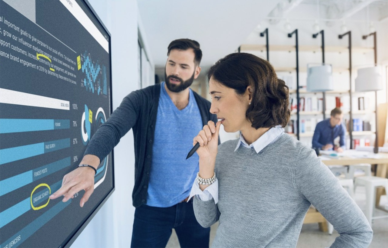 Two Co-Workers Using the C7520QT Monitor