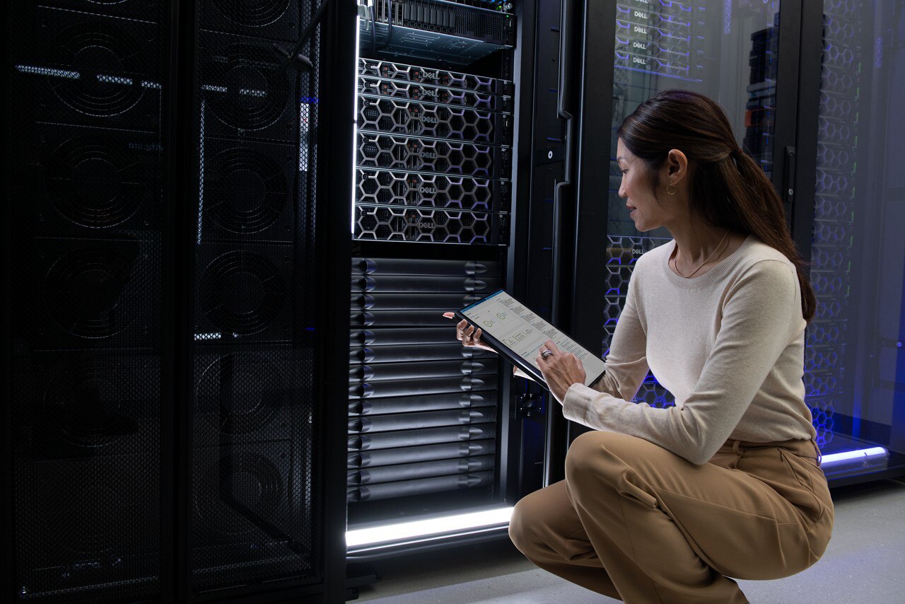 Woman Kneeling Down Working From Data Center