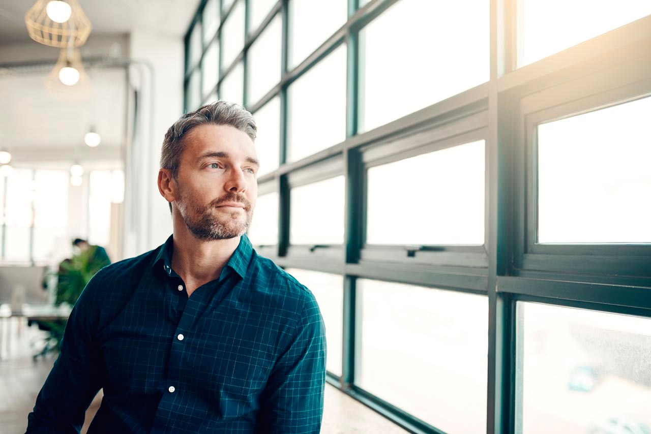 Man Looking Outside Window