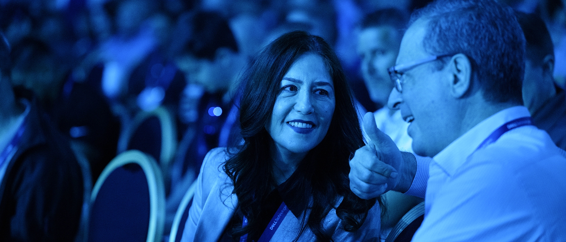 Two conference attandees chatting at a partner networking event