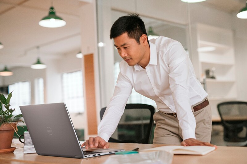 Focused Businessman Working on his Laptop in a Modern Office