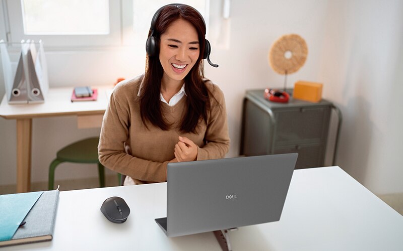 Young Woman Smiling While Working from Home Office