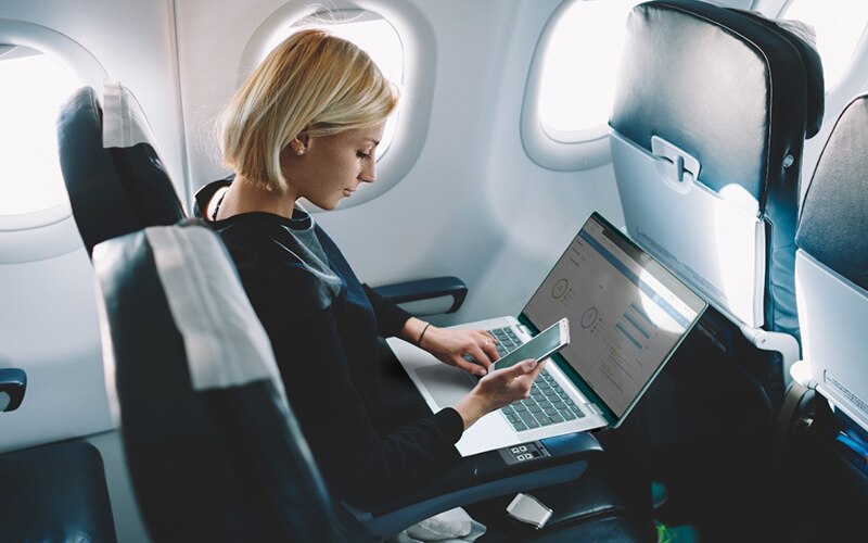 Female Traveler Working on Laptop