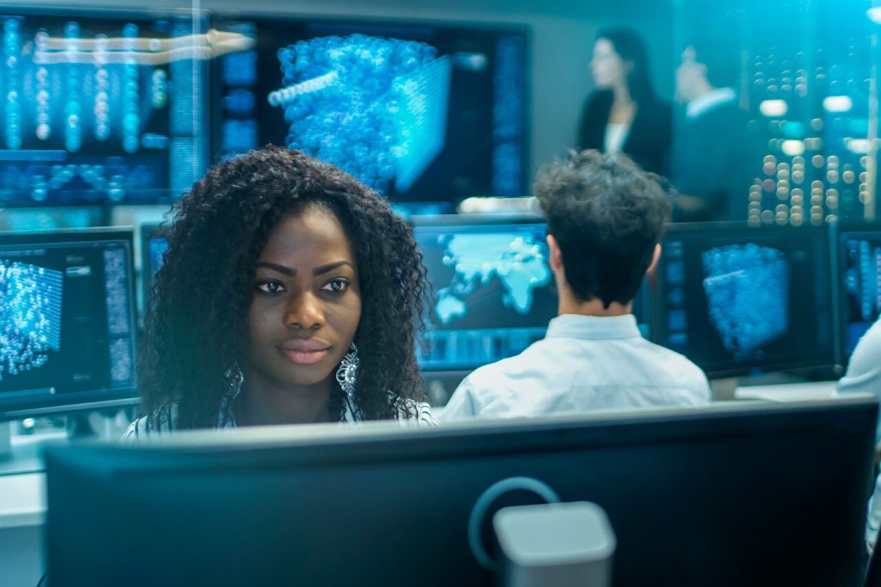 Female Computer Engineer Works on a Neural Network