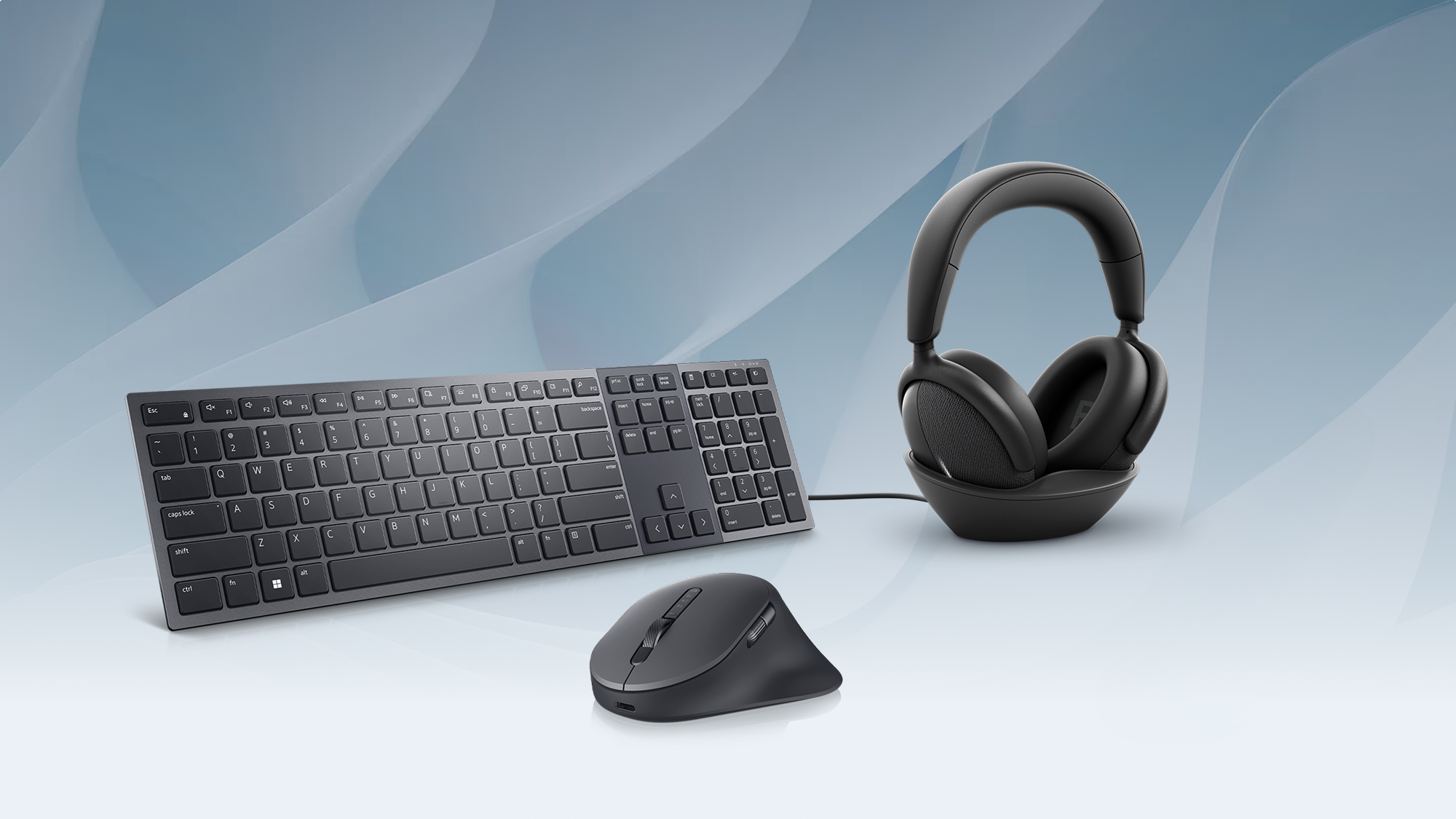 Image of PC accessories that include headphones, keyboard and mouse
