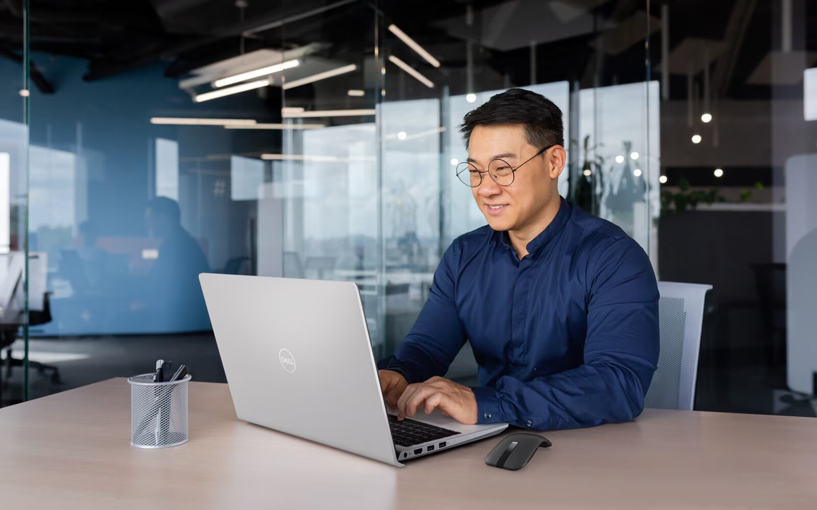 Businessman Working From Glass Office