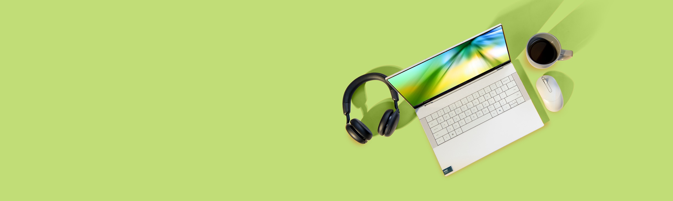homepage hero site lifestyle banner featuring FY26 Amazon Dell Days - Retail Asset with screen showing Abstract Background in Yellow, Green and Blue Colors