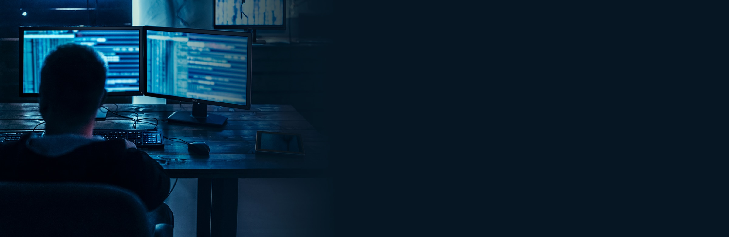 Man Working on Multiple Monitors