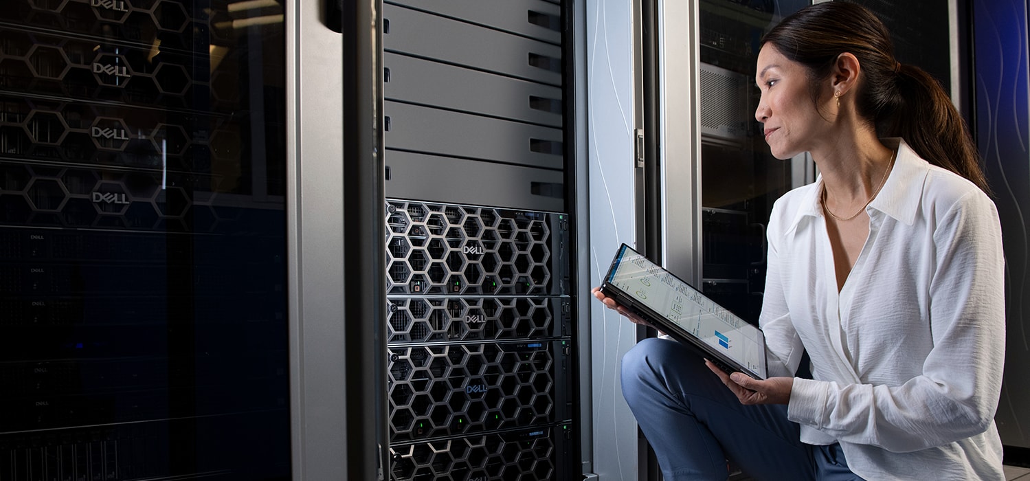 Woman Kneeling Down Working From Data Center 