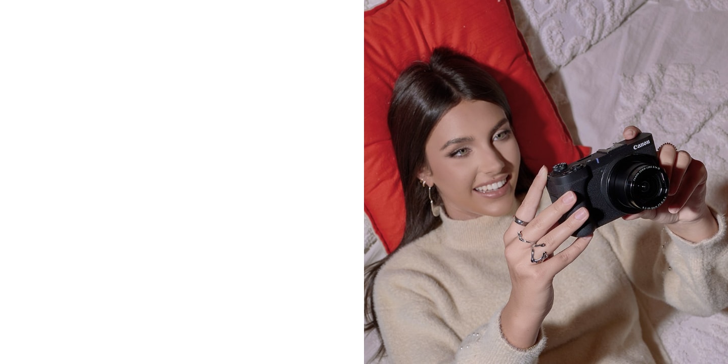 girl holding canon camera