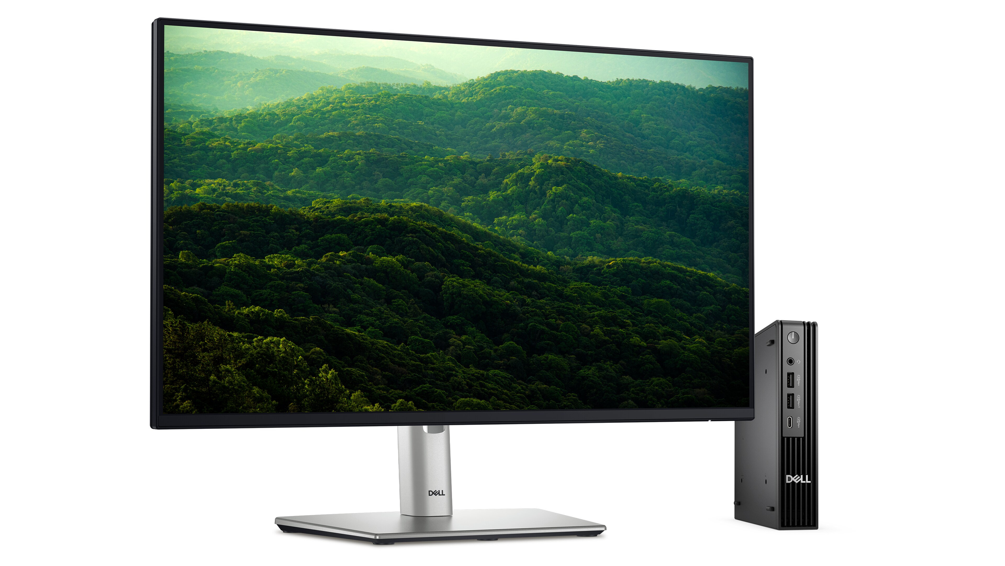  Dell Pro Micro next to Dell Monitor p2425h on white background. Screenfill of rolling hills filled with green trees.