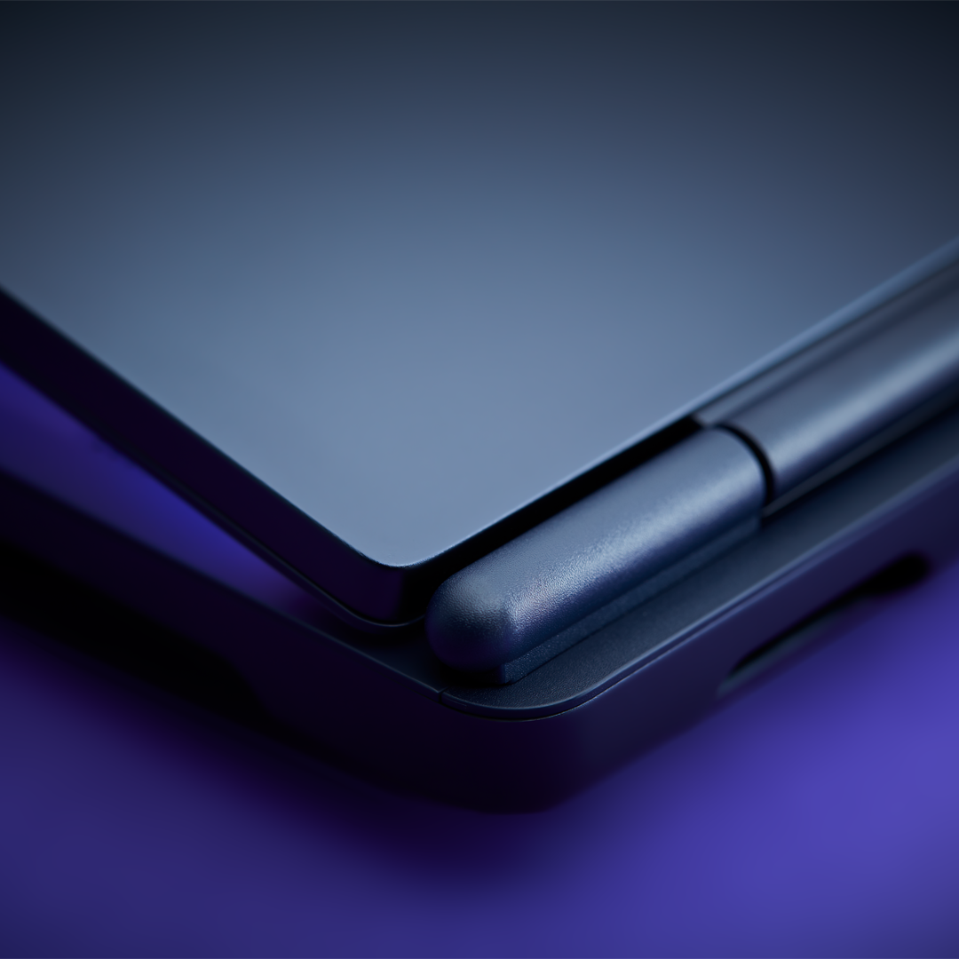 Two Alienware Aurora gaming laptops side by side, highlighting the Interstellar Indigo finish of the laptop’s chassis.