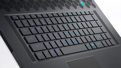 Picture of Dell Alienware x17 R2 Gaming Laptop keyboard with lights on and a few keys floating above the product.