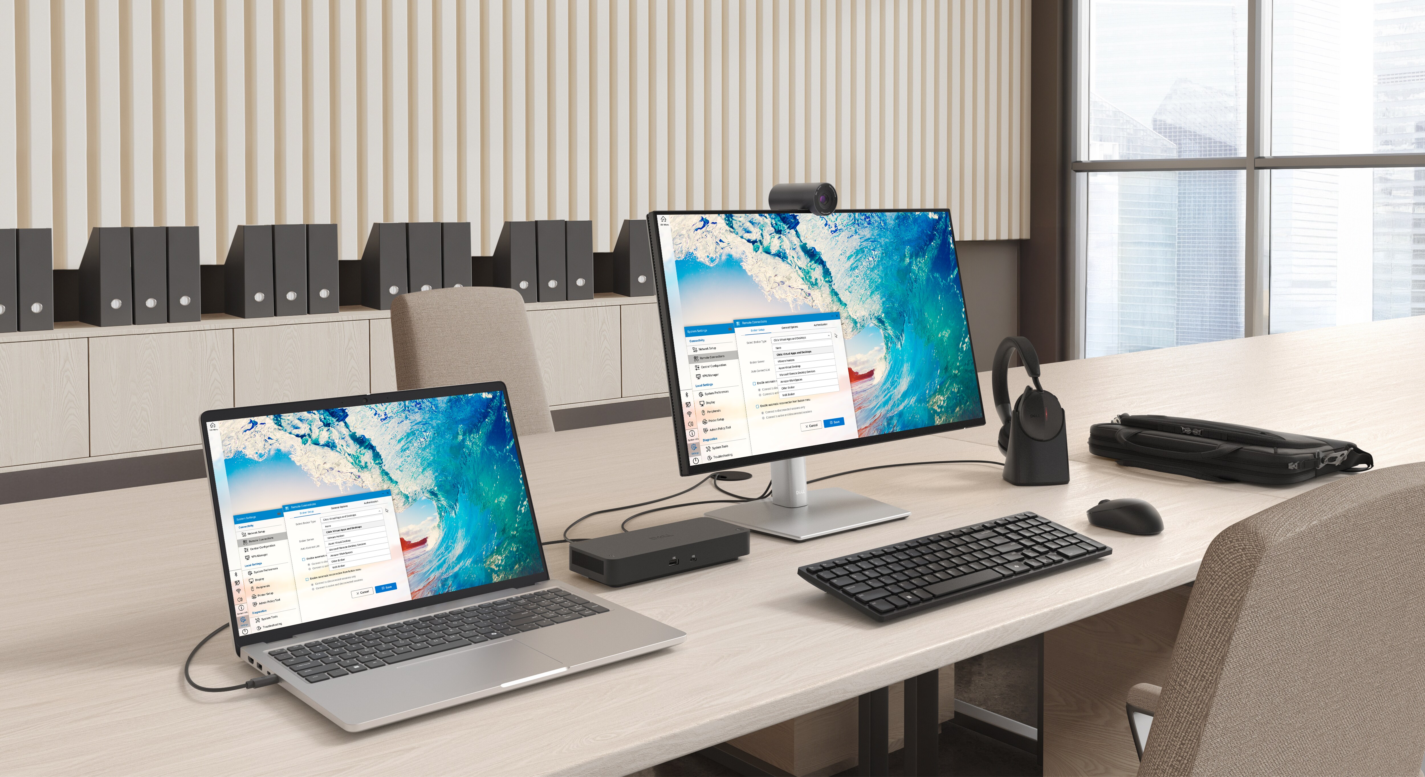 A neatly arranged desk with a Dell Pro 14 Laptop, a Dell desktop computer, webcam, wireless headphones and other accessories.