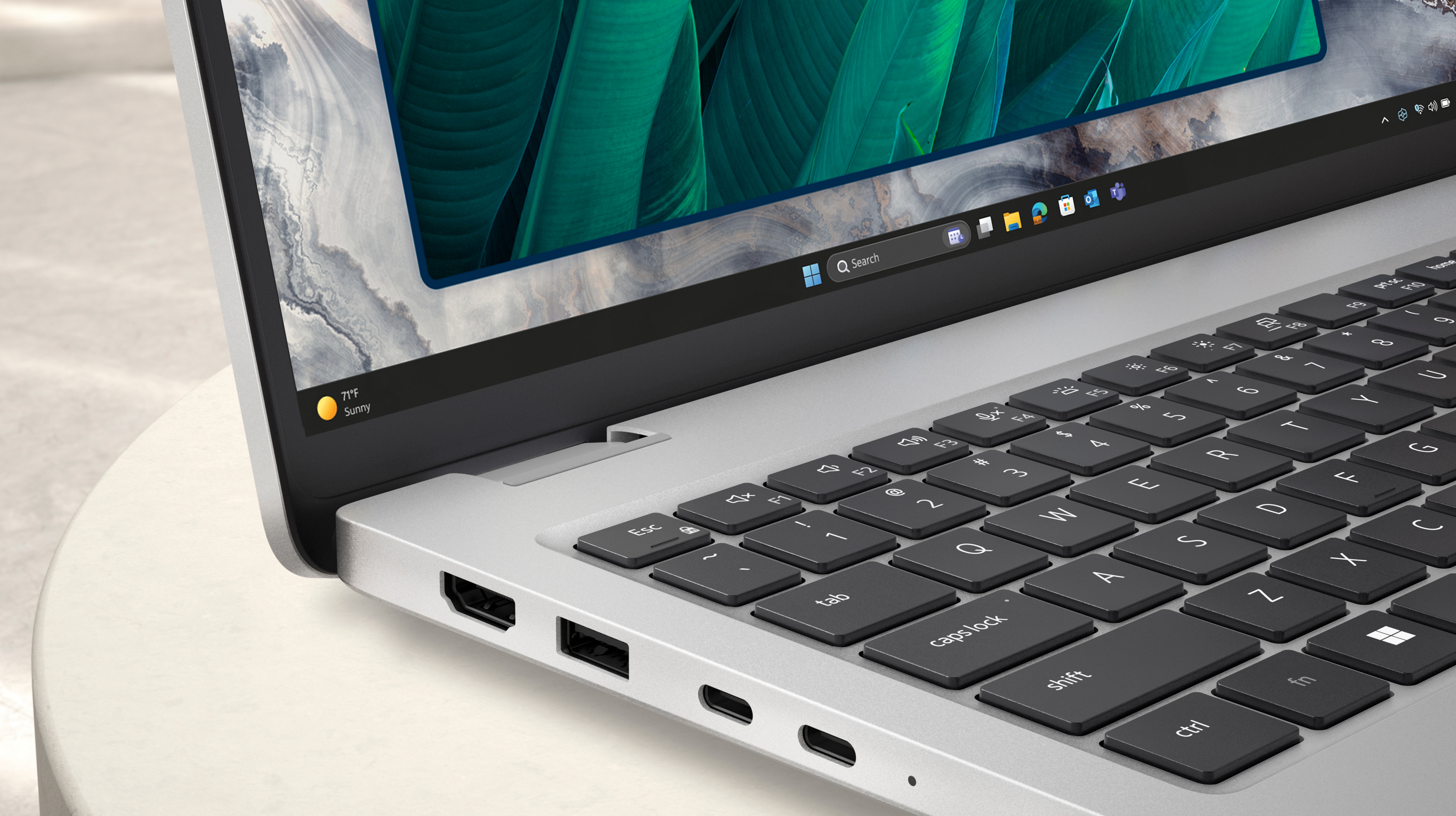 A close-up shot of a corner of a Dell Pro 16 Plus laptop, highlighting its durable and sustainability-focused design.