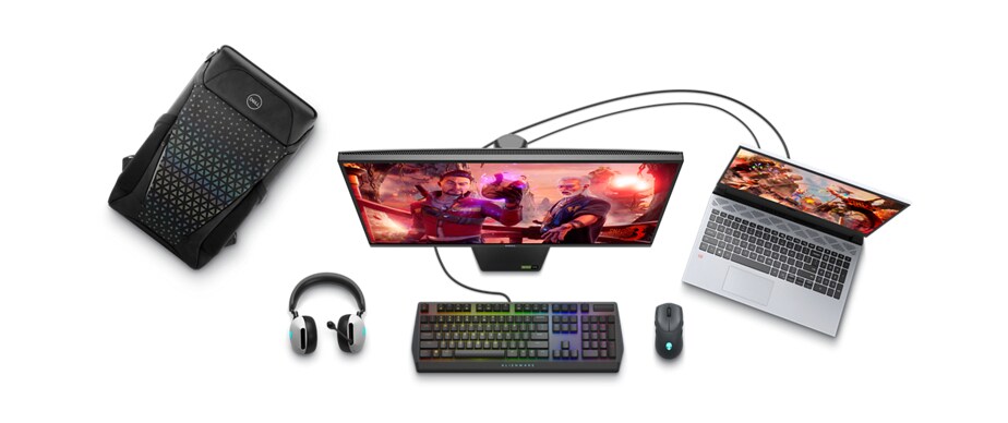 Picture of a Dell 5525 Gaming Laptop connected to a monitor, a keyboard and mouse with a backpack and a headset next to it.