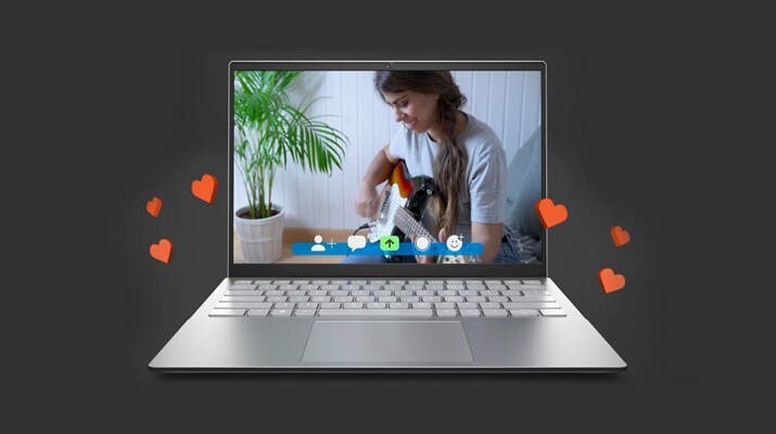 Bild eines Dell Inspiron 14 5420 Laptops mit einer Frau, die Gitarre spielt, während rote Herzen aus dem Bildschirm steigen.