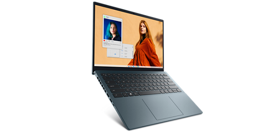 Picture of a Dell Inspiron 14 7420 Laptop with a redhead woman in front of a orange wall on the screen