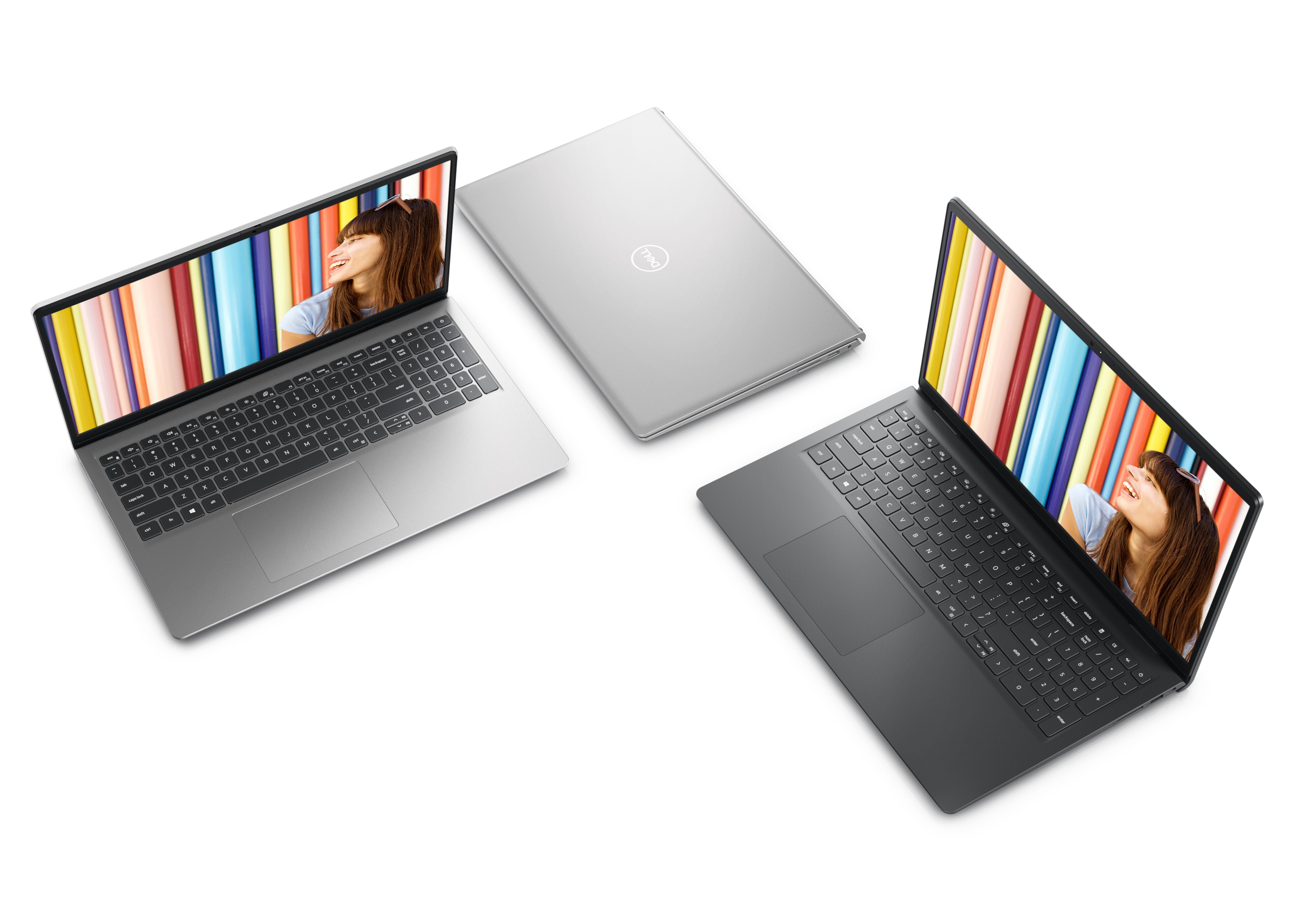 Bild mit drei nebeneinander stehenden Dell Laptops vom Typ Inspiron 15 3525. Zwei der Laptops sind geöffnet, ein Laptop ist geschlossen.