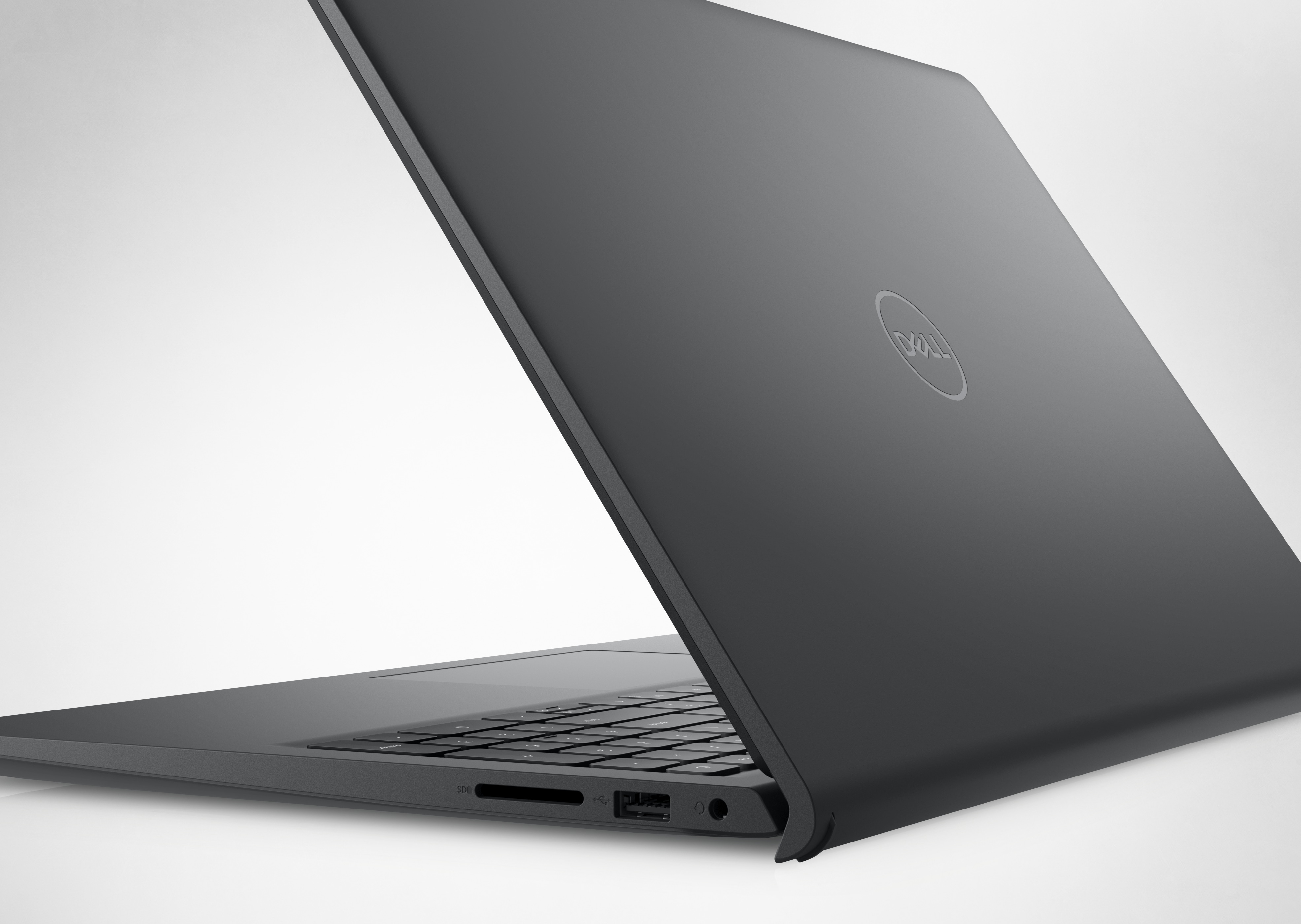 Bild eines geöffneten Dell Laptops vom Typ Inspiron 15 3525, in dem die Rückseite und das Dell Logo sichtbar sind.