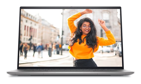 Picture of a Dell Inspiron 16 5620 Laptop with a woman wearing a yellow sweater with her hands in the air on the screen.