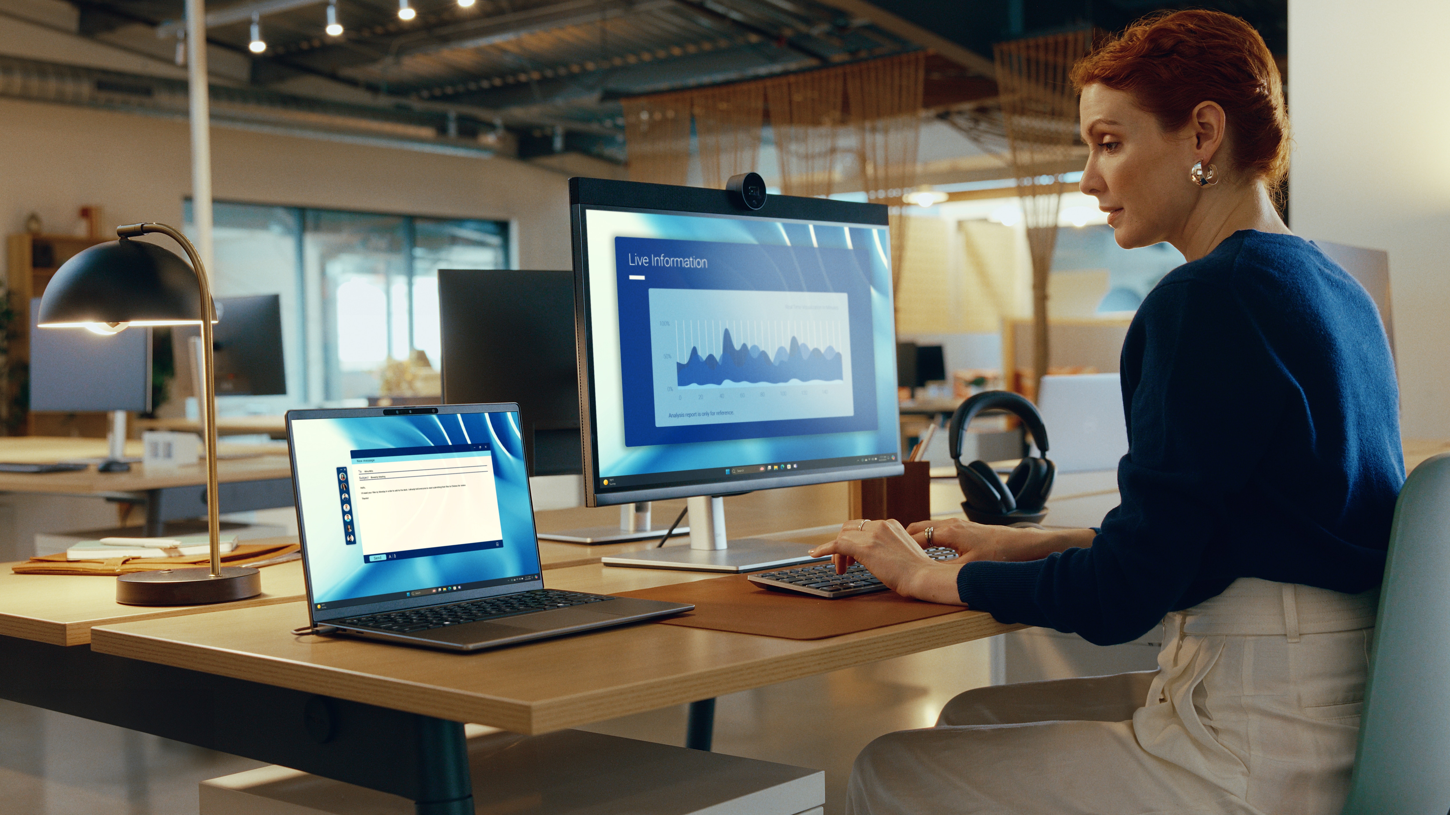 Latitude 7455 laptop connected to an ecosystem of Dell products in a workspace.