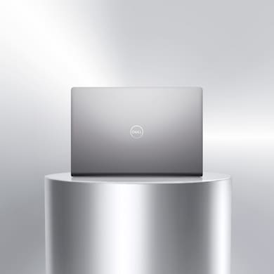 Picture of a Dell Vostro 14 3425 Laptop above a metallic object showing the back of the product with the Dell logo.