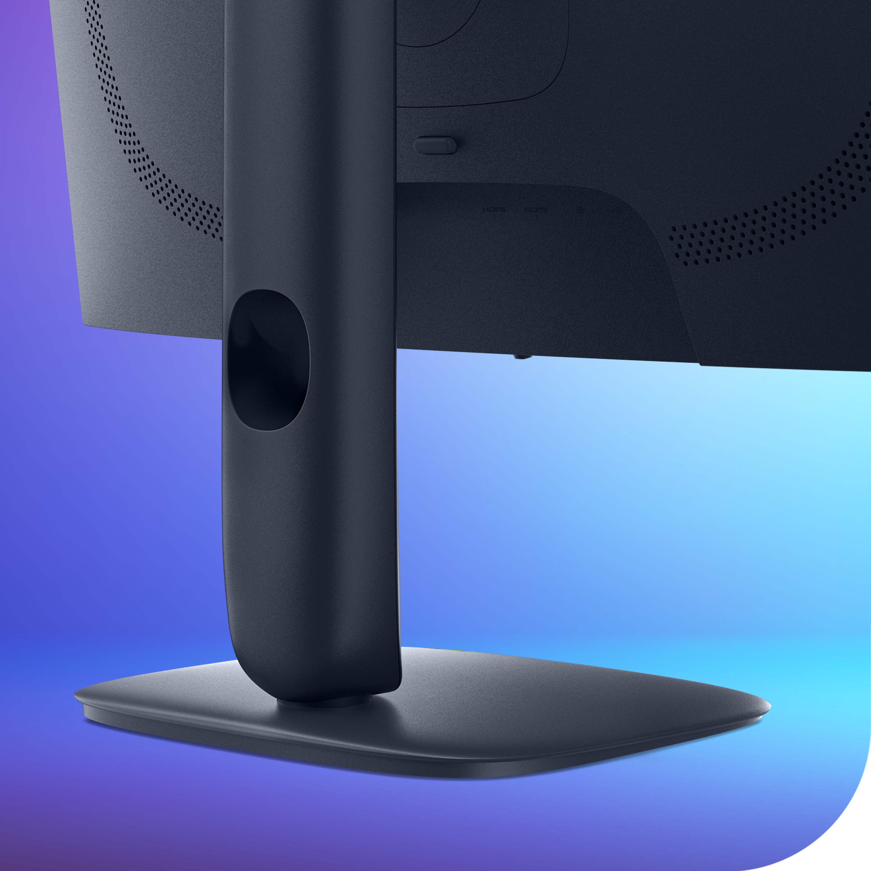 Close-up of the monitor stand, highlighting the cable management hole.