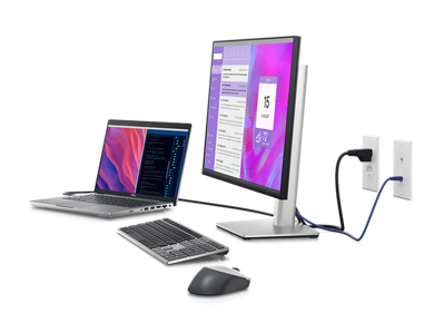 Dell dizüstü bilgisayar, klavye ve fareye bağlı bir Dell P2423DE Monitörün resmi.