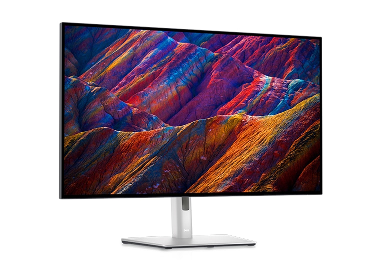 Picture  of  Dell  UltraSharp  U3223QE  Monitor  in  a  white  background with  a landscape imageon the screen.
