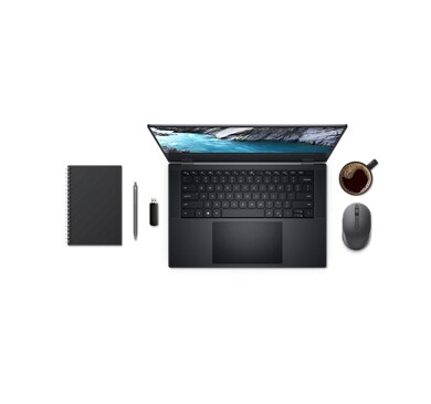 Продукция Dell, ноутбук, ручка, флэш-накопитель и кофейная кружка — все это видно сверху.