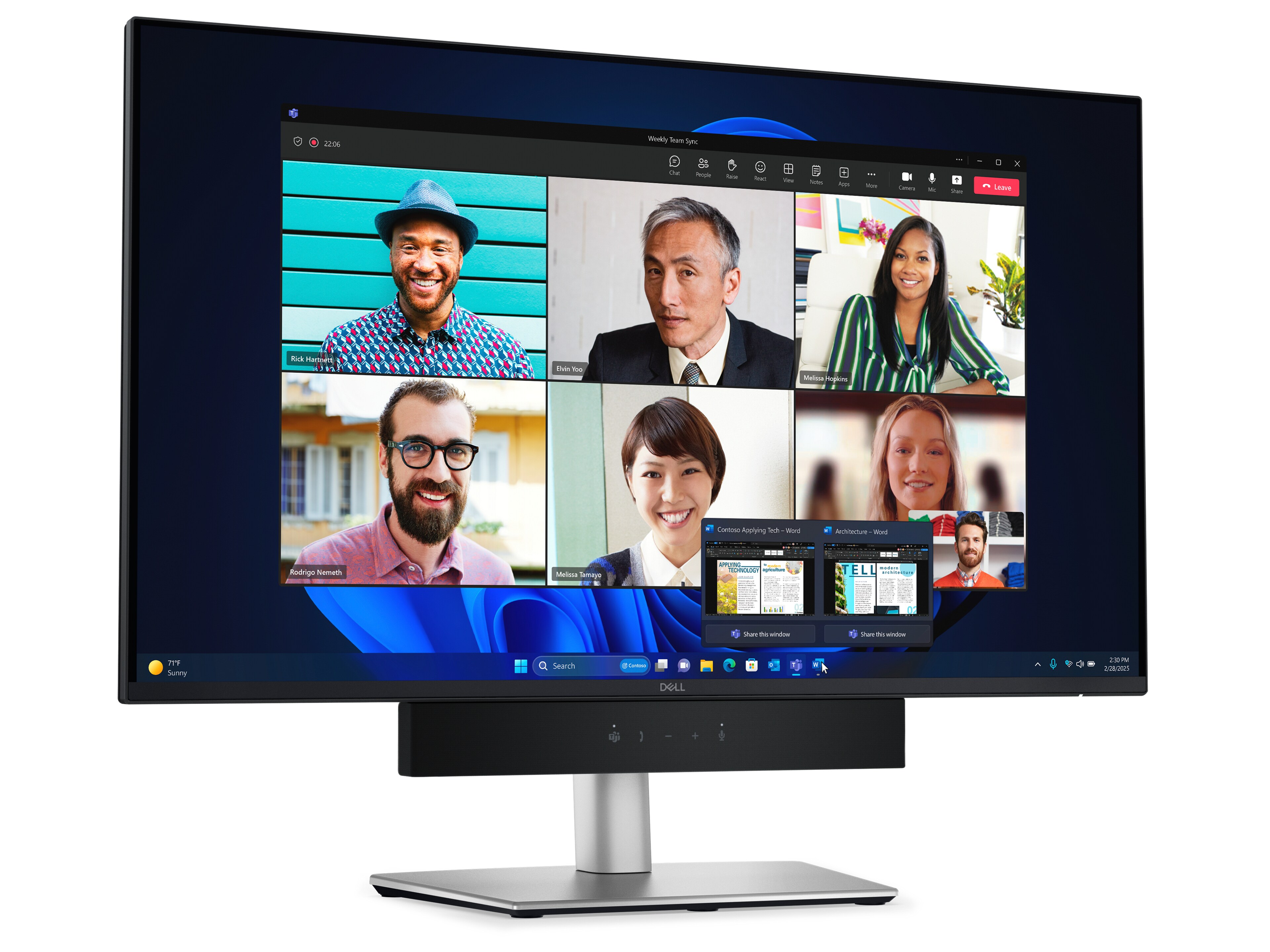A monitor showing a video conference with multiple attendees on webcams.