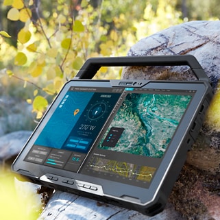 Dell Latitude 12 7230 tablet leaning against a rock outdoors
