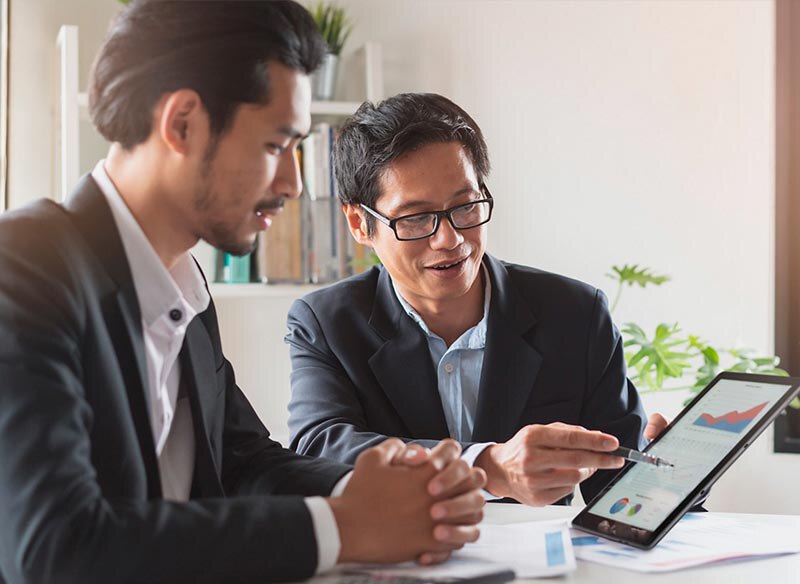 Financial Advisor Showing Plan of Investment to Client