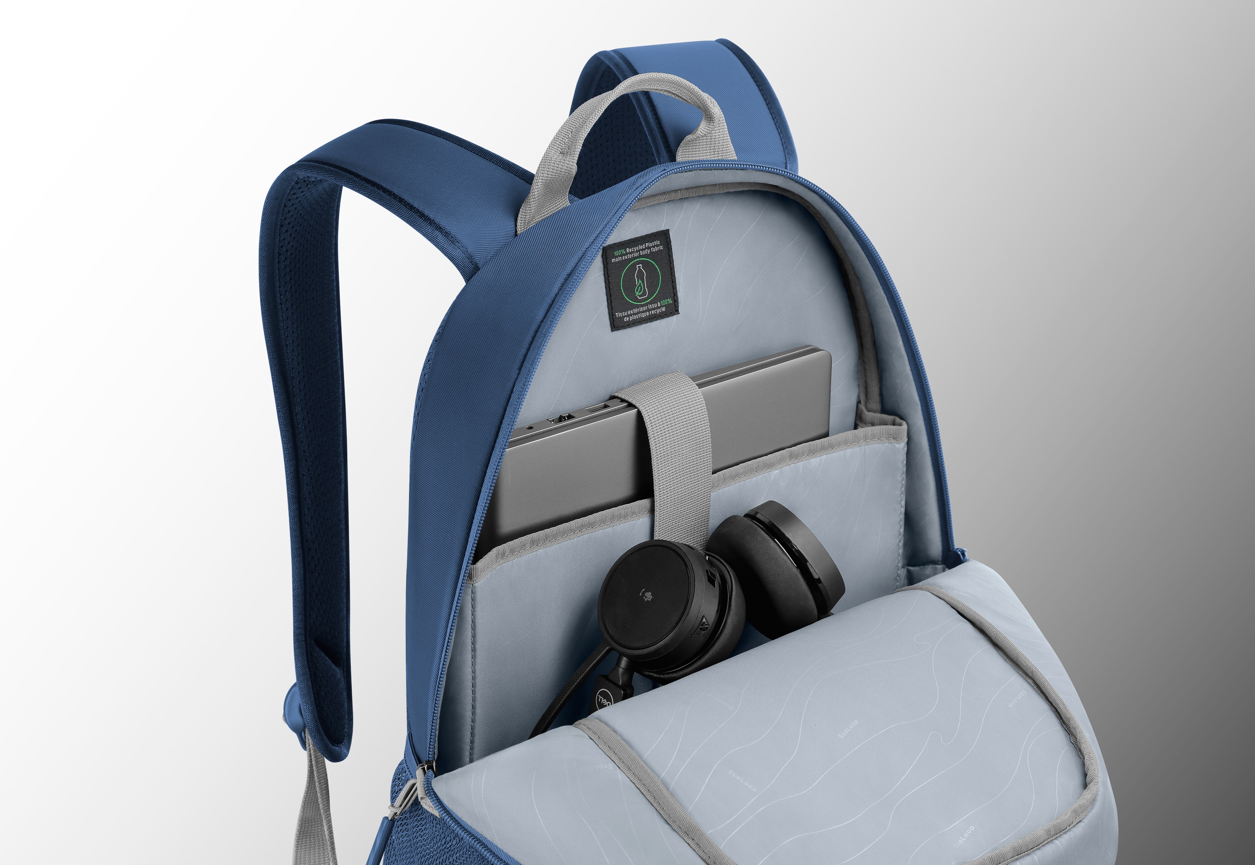 Picture of an opened Dell EcoLoop Urban Backpack CP4523B with a laptop and a headset inside.