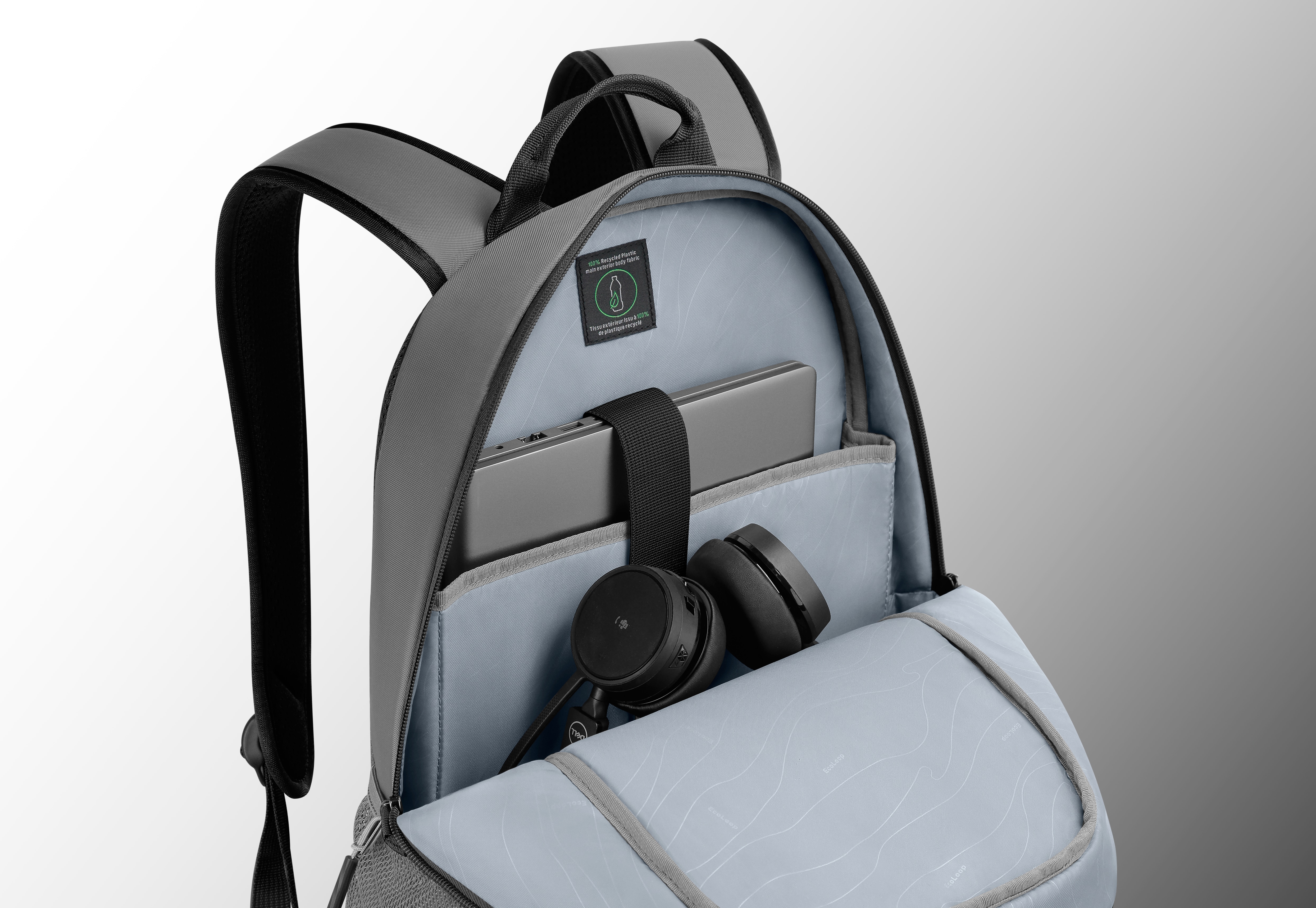 Imagem de uma mochila Dell EcoLoop Urban CP4523G aberta com um notebook e um headset dentro.